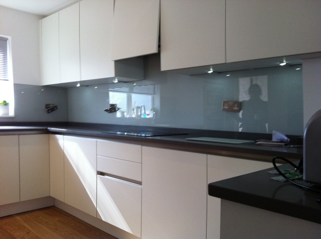 Grey glass kitchen splashback with LED lighting in Gerrards Cross