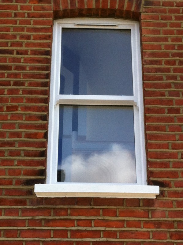 uPVC sash window on Victorian red brick house in Gerrards Cross